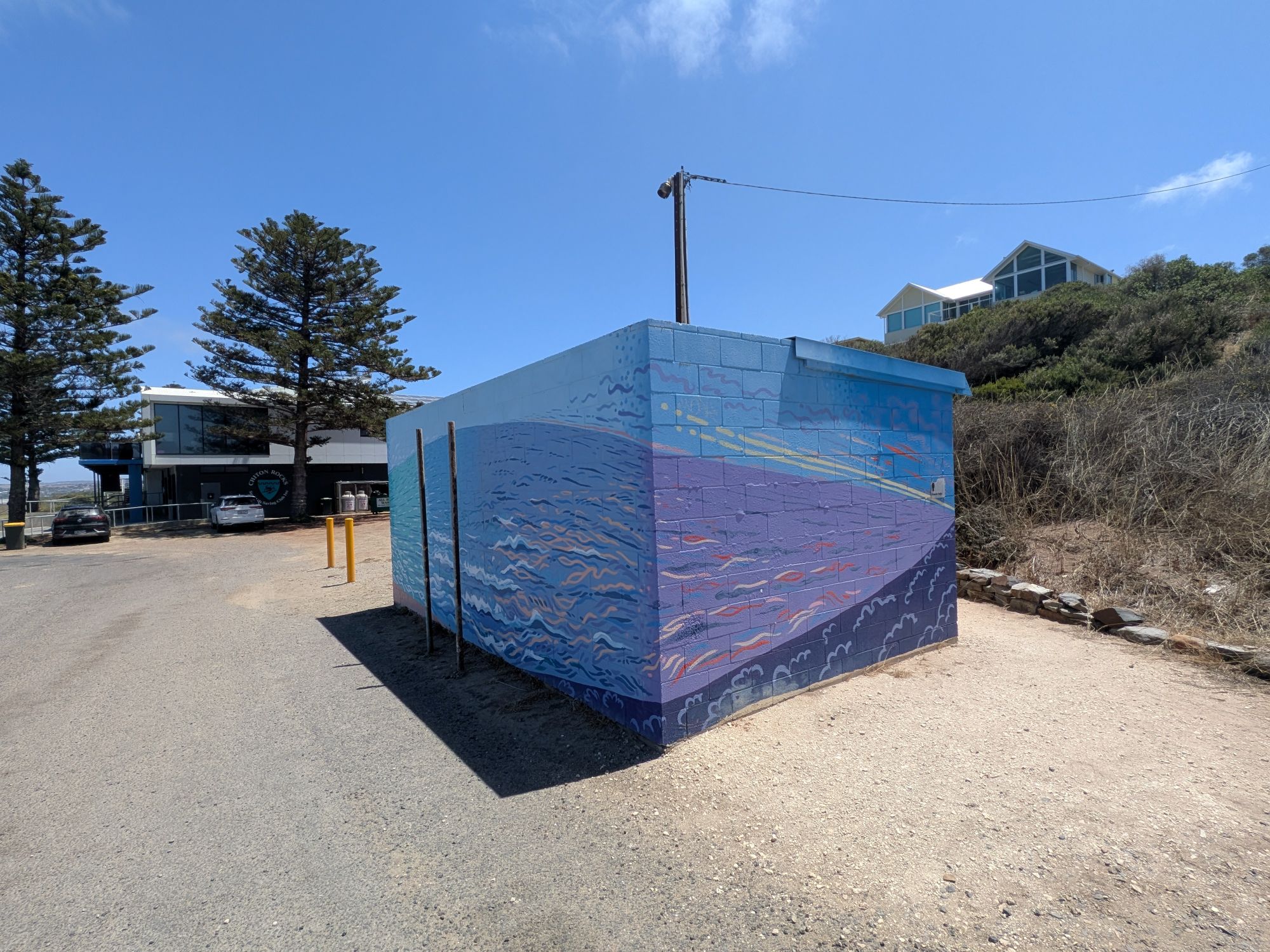 Besser block public toilet with seascape mural at Chiton Rocks Surf Club.