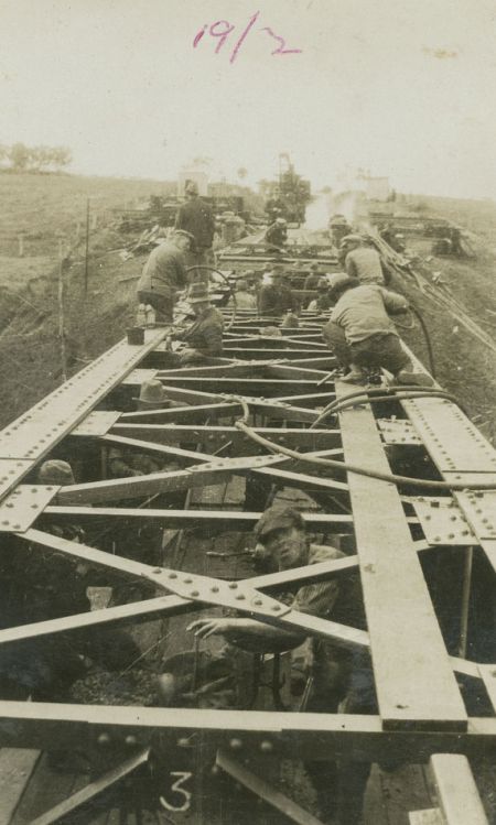 Men erecting a railway bridge