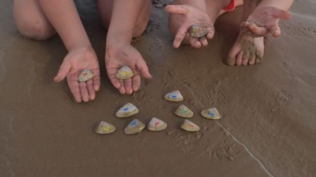 Children holding Cockles
