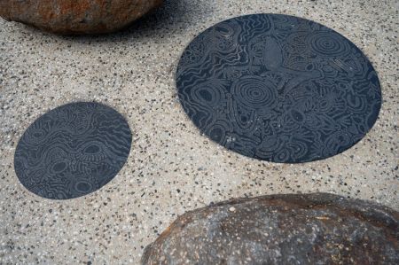 Image of granite etched with First Nations artwork