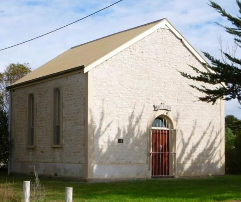 Facade of white stone heritage listed Milang Chapel.