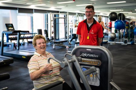 Lady with personal trainer doing exercise