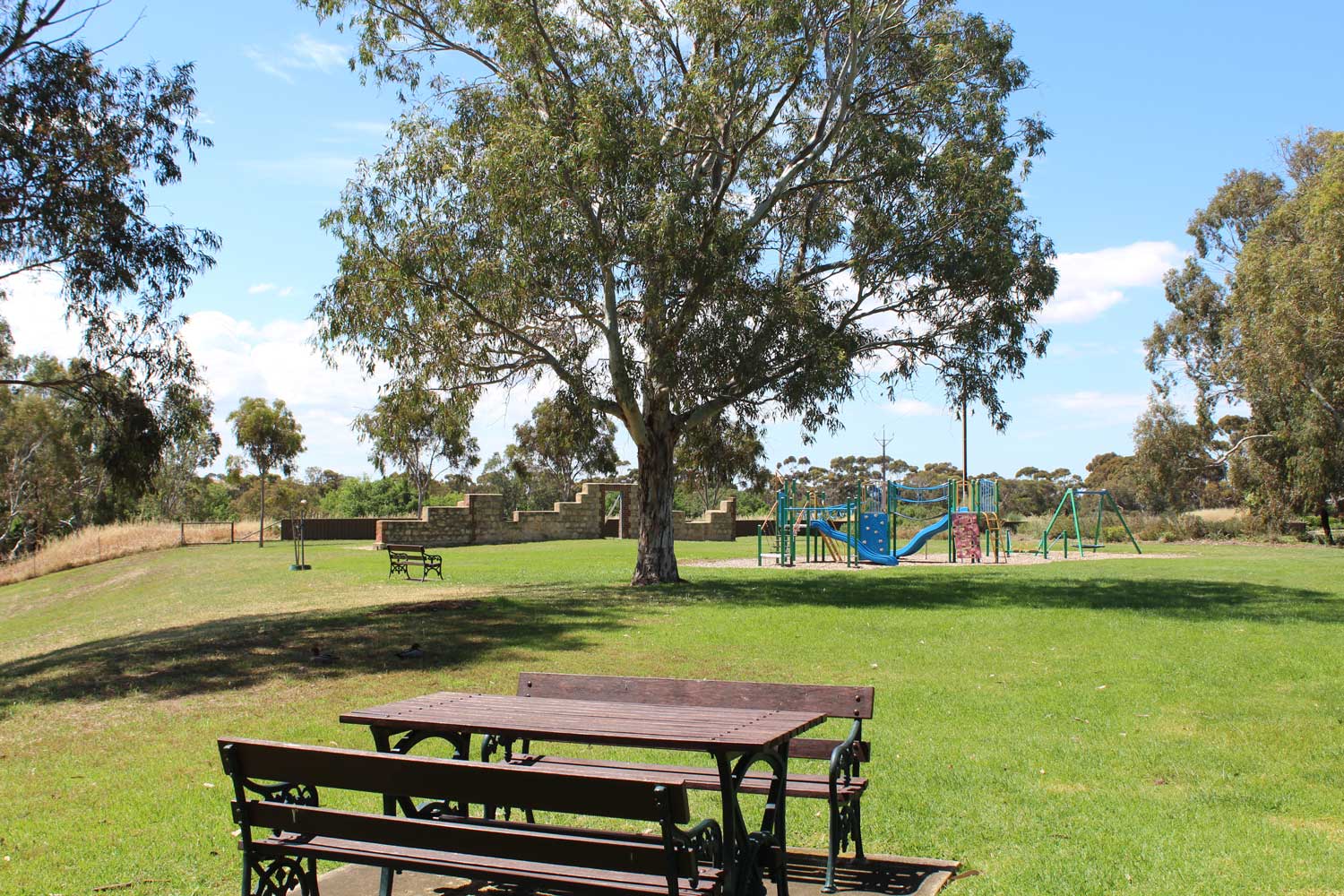 Angas Glen Reserve seating with playground in the distance