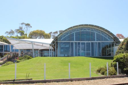 Front view of the Singal Point Experience Centre on a sunny day