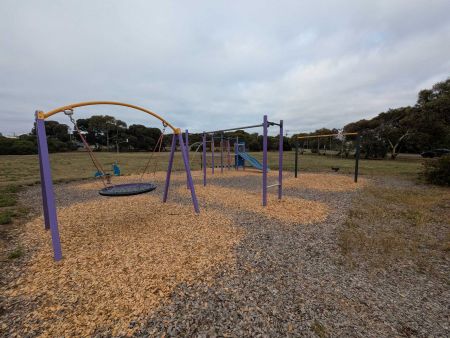 Bradford Road Reserve Playground with swing set, flying fox and play platform with a slide